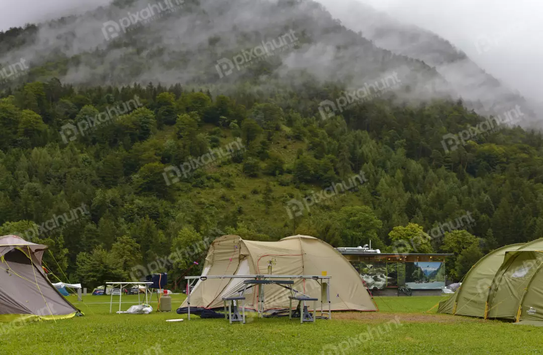 Misty Mountain Campsite with Tents, Outdoor Adventure in Foggy Forest