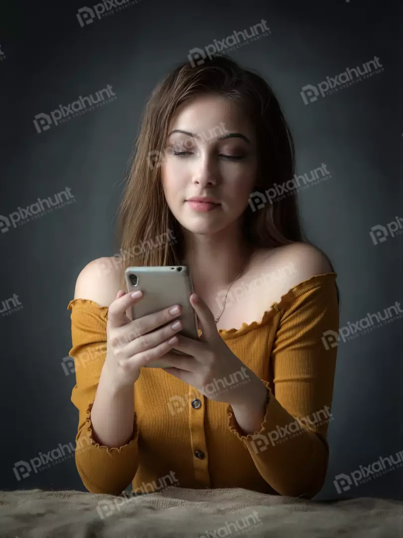 Young Woman Serene Smartphone Focus in Off-Shoulder Ribbed Top