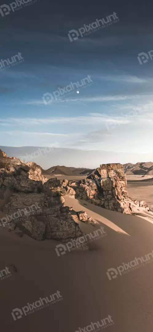 Free Premium Stock Photos Moonlit Desert Rock Formation at Dusk with Streaky Clouds