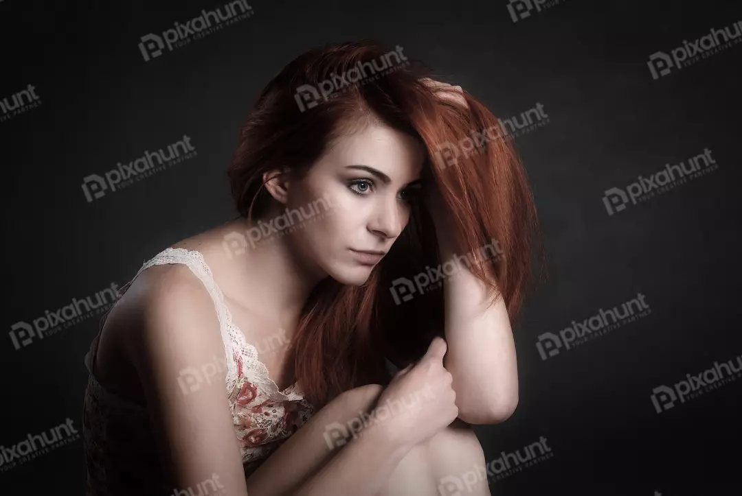 Intense Pensive Redhead Woman Portrait with Hand in Hair