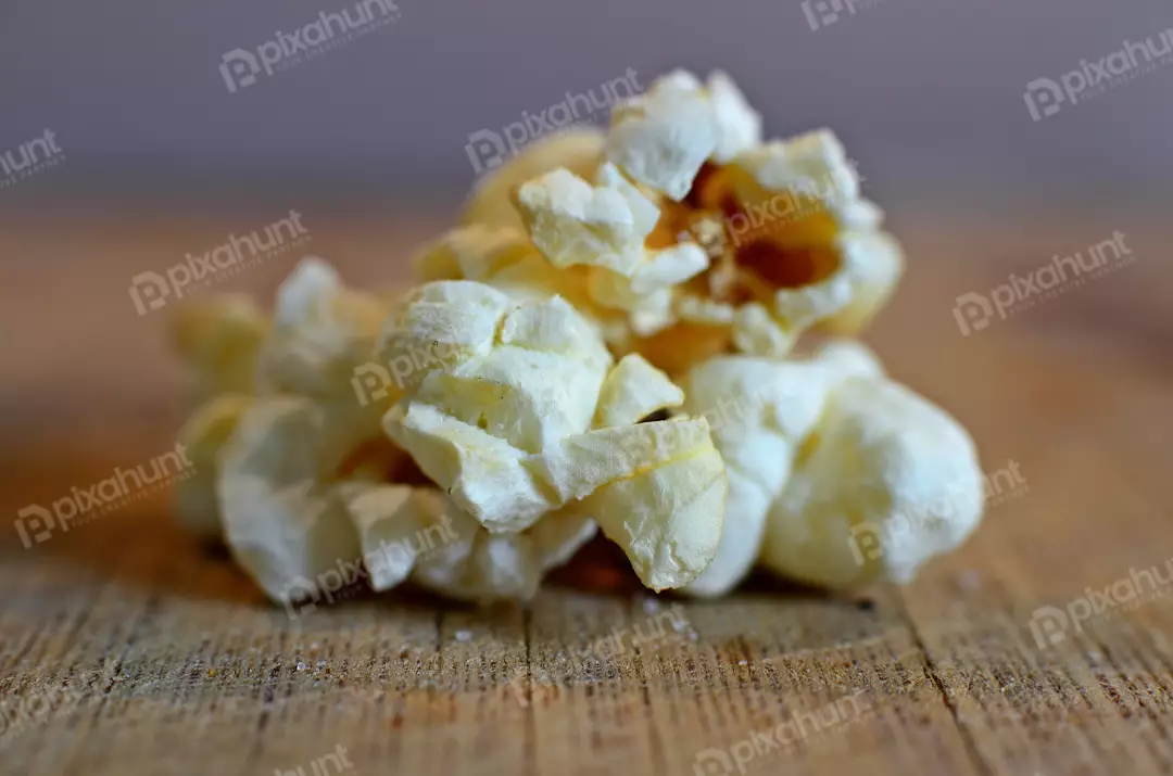 Crunchy White Popcorn Kernels on Rustic Wood for Movie Snacks