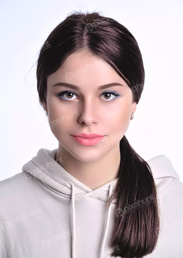 Beautiful Young Woman Gazing at Camera in Hoodie Natural Beauty Studio Shot