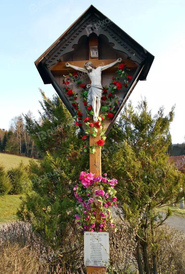 Ornate Wooden Wayside Cross with Jesus Christ Figure and Floral Adornments