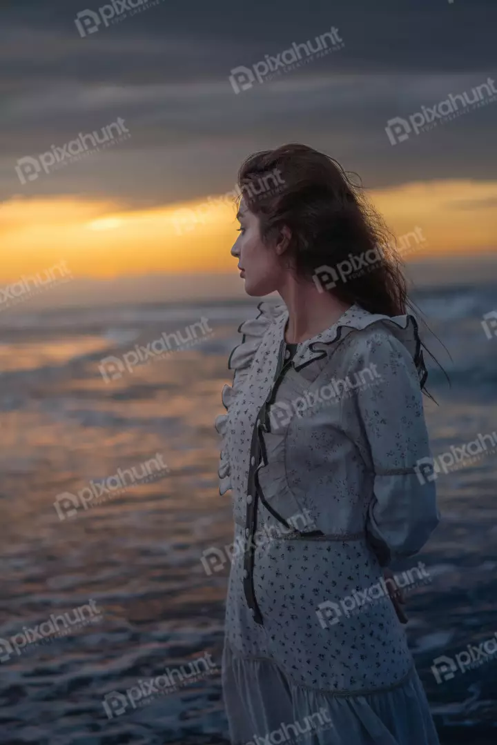 Free Premium Stock Photos Vintage Woman on Beach at Golden Sunset