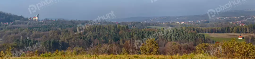 Panoramic View of European Countryside with Monastery and Rustic Chapel