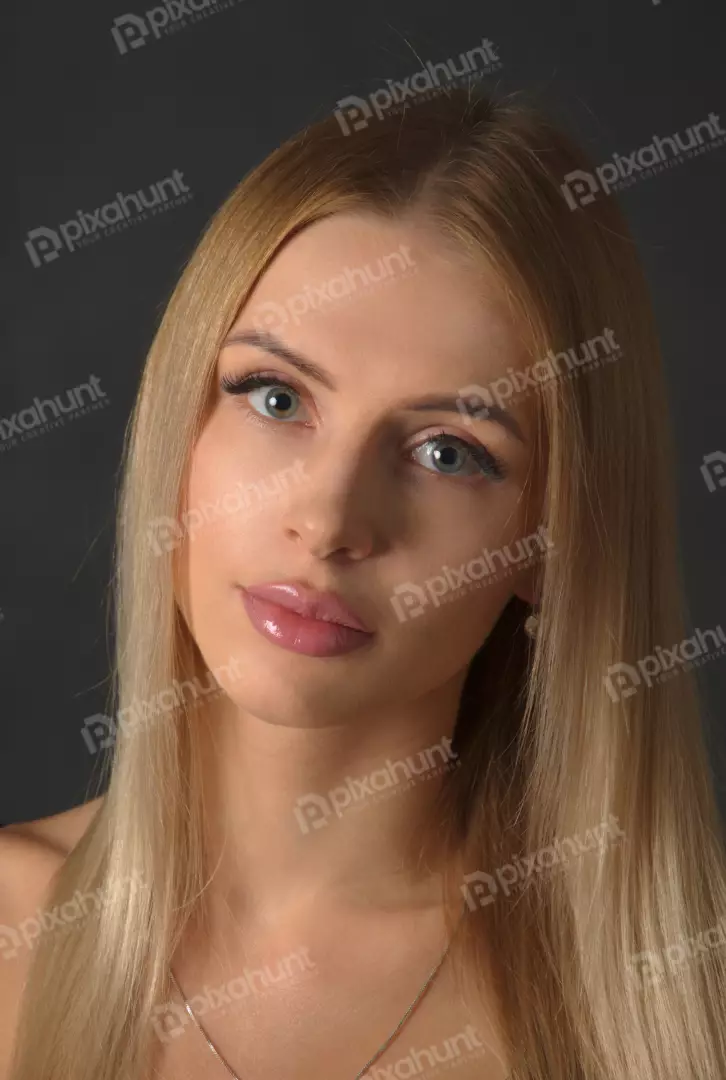 Captivating Young Woman with Blue-Green Eyes and Blonde Hair