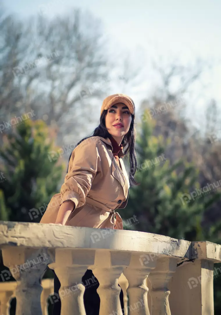 Free Premium Stock Photos Stylish Woman in Trench Coat on Balcony Overlooking Trees