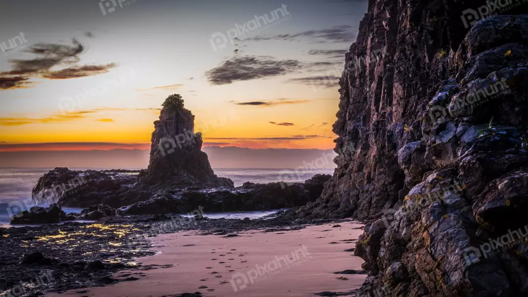 Free Premium Stock Photos Vibrant Coastal Sunset Over Rugged Sea Stack ...