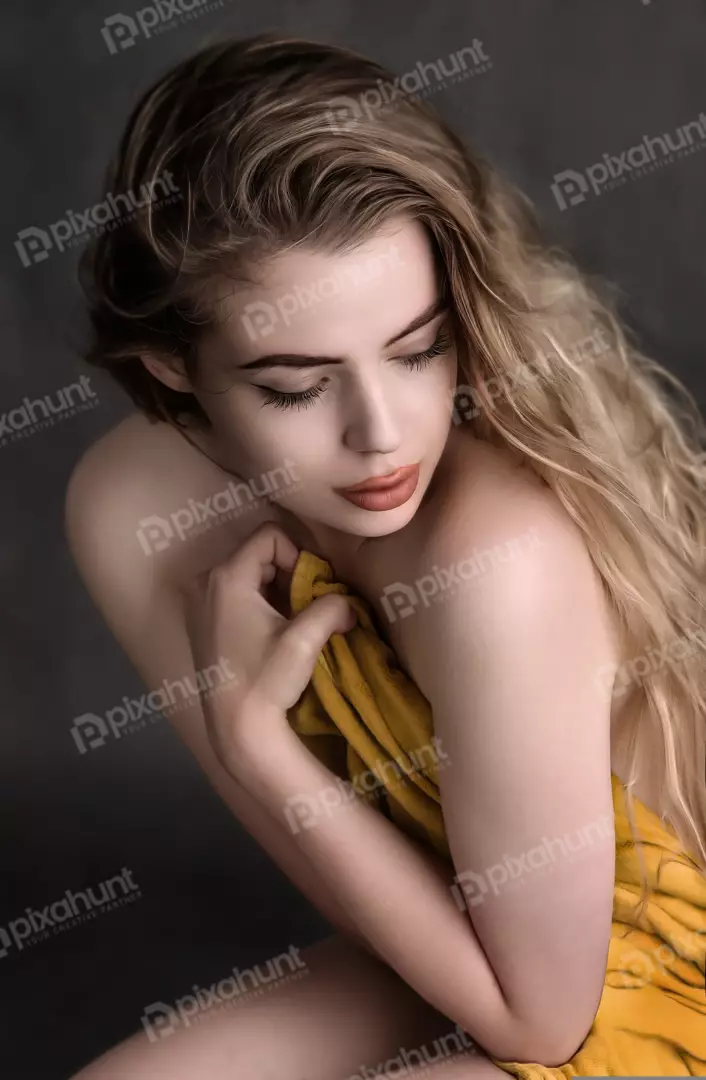 Pensive Young Woman with Golden Drape and Flowing Blonde Hair