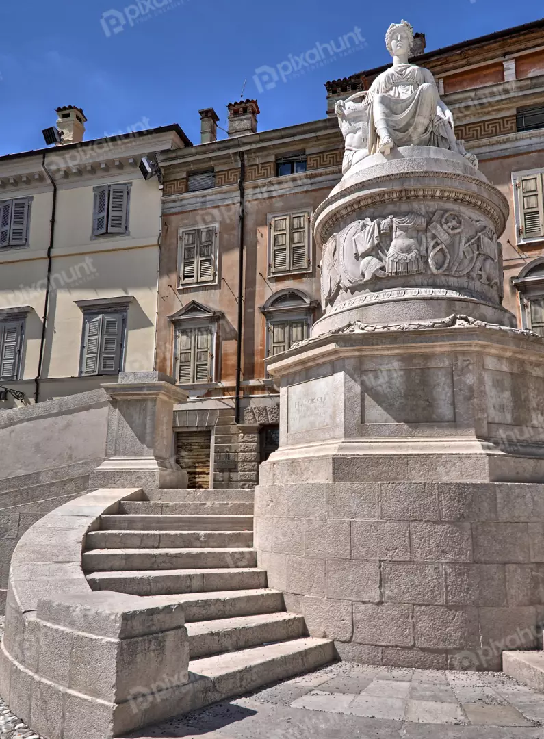 Grand Stone Statue and Curved Steps in Historic European City Square