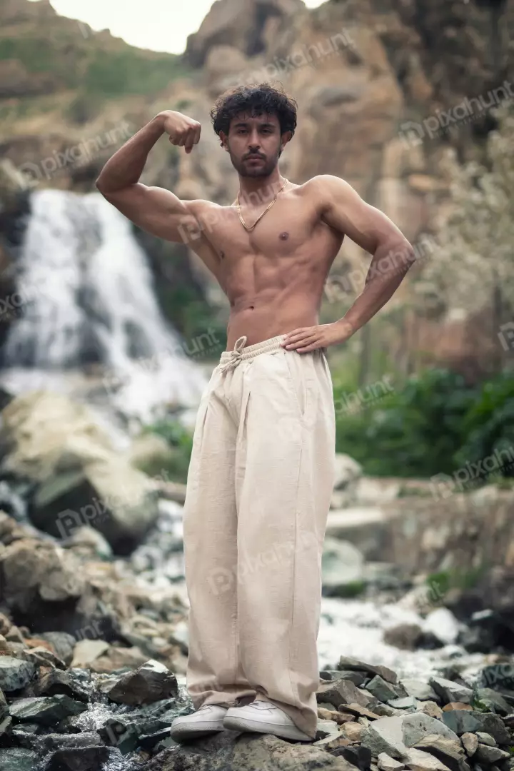 Free Premium Stock Photos Muscular Young Man Posing Outdoors by Waterfall