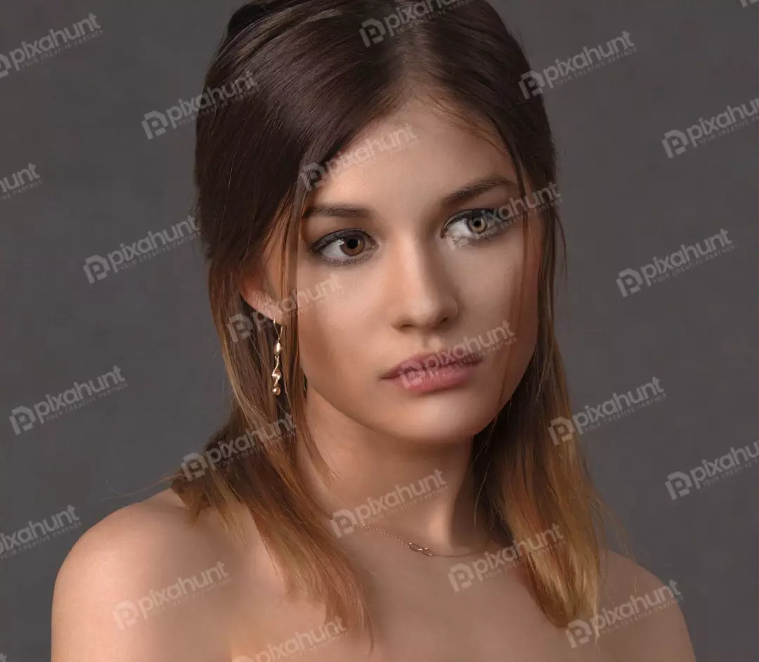 Captivating Portrait of a Pensive Young Woman with Brown Eyes and Bare Shoulders
