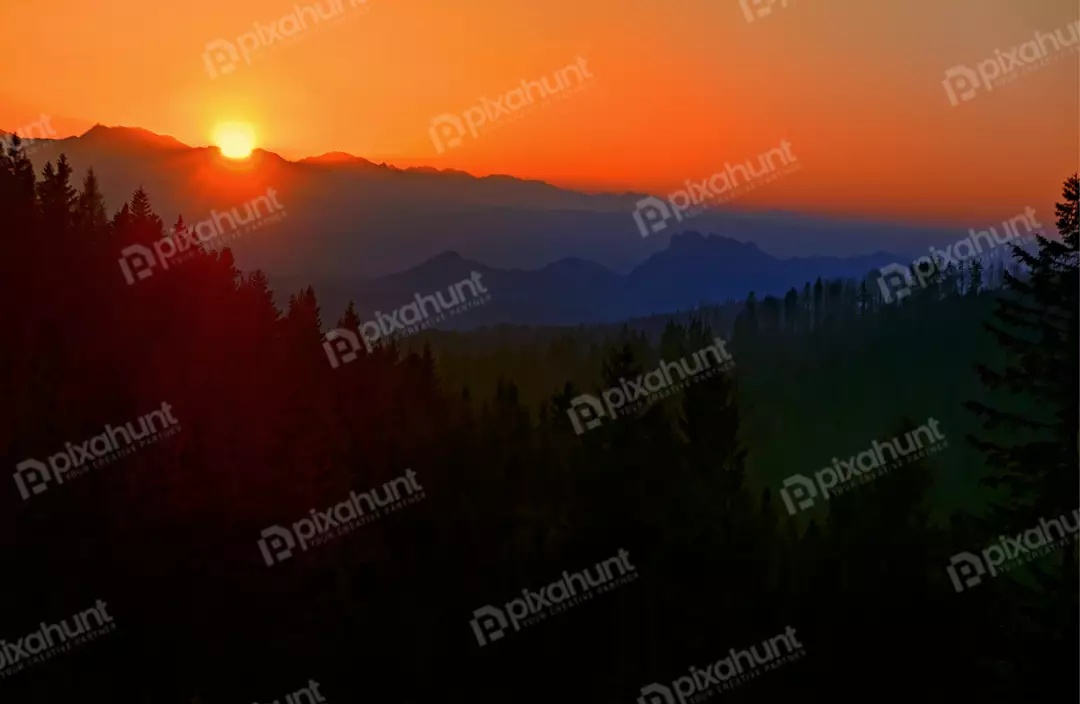 Vibrant Sunset Over Majestic Mountains and Forest Landscape