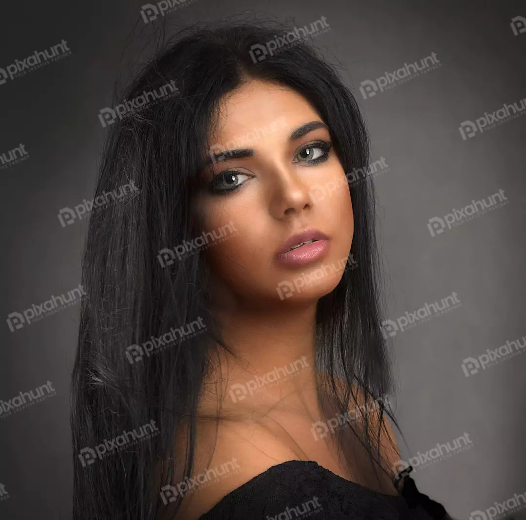 Captivating Portrait of Young Woman with Dark Hair and Expressive Eyes