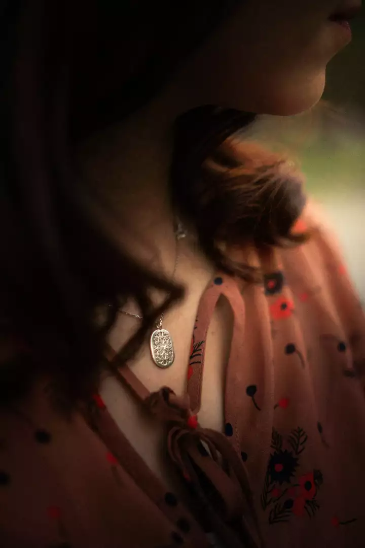 Free Premium Stock Photos Woman wearing a floral print dress with a delicate necklace