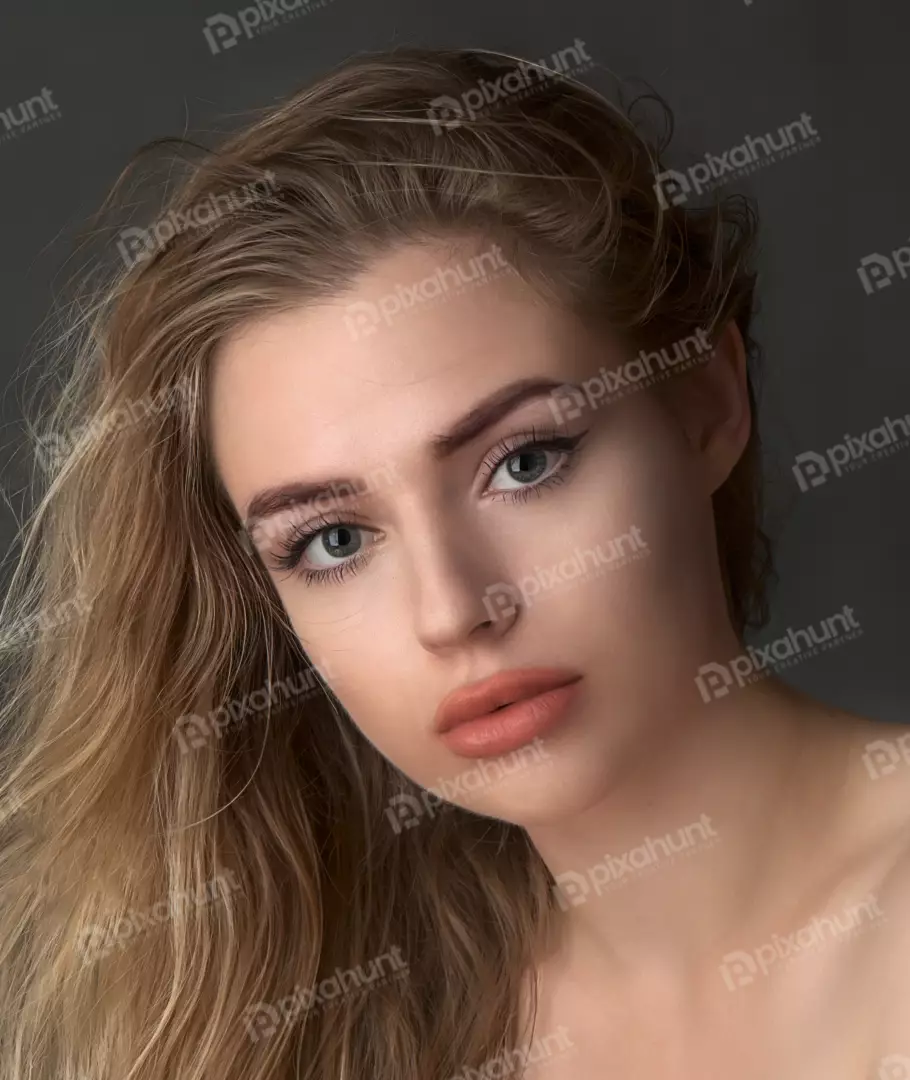 Elegant Young Woman with Wavy Blonde Hair and Expressive Gaze