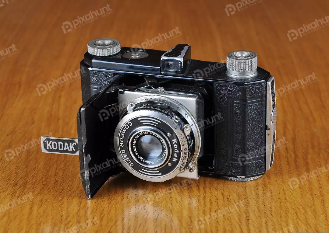 Vintage Kodak Retina Folding Camera on Classic Wooden Table