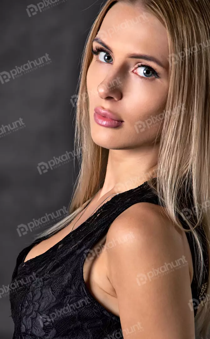 Blonde Woman in Black Lace Top with Captivating Gaze