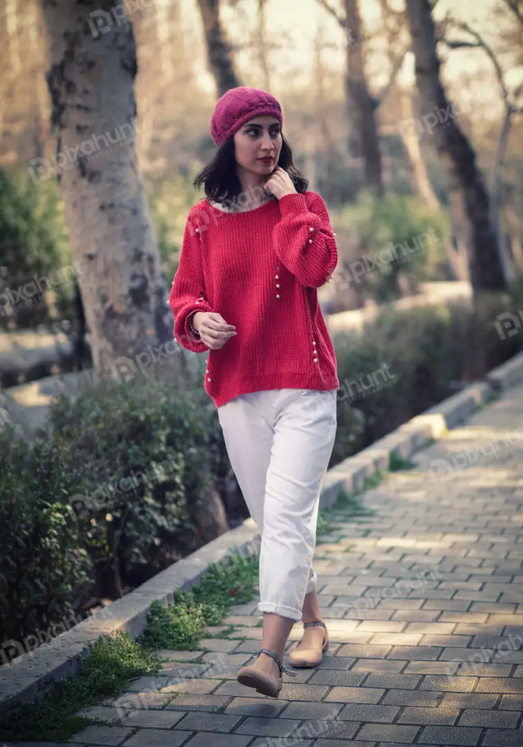 Free Premium Stock Photos Young Woman in Red Sweater Walking on Park Path