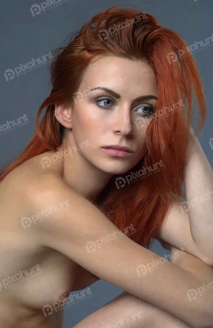 Pensive Redhead Woman with Blue Eyes, Freckles, and Natural Beauty Portrait