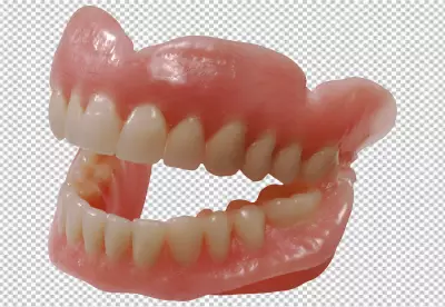 The dentures are made of a pink acrylic material and have a full set of teeth