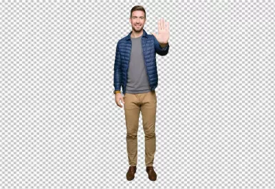 Smiling Young Man in Blue Puffer Jacket Making Stop Hand Gesture Confidently image