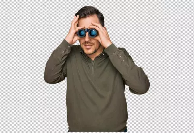 Young Man Actively Searching with Binoculars in a Focused Pose image