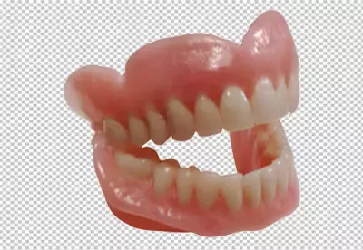 The dentures are made of a pink acrylic material and have a full set of teeth