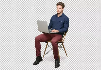 Focused Young Professional Man Working on Laptop while Sitting on Modern Chair image