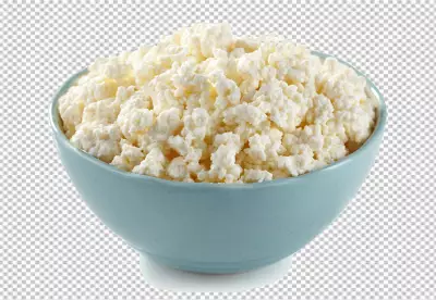 A bowl of sour cream cheese with mint leaves on it PNG