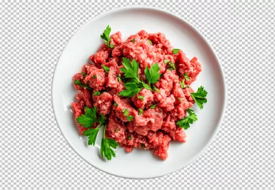 Fresh Raw Minced Meat with Green Parsley on White Plate for Culinary Creations image