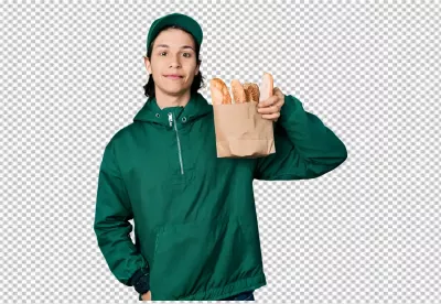 Young Man in Green Uniform Smiling, Delivering Fresh Artisan Bread image
