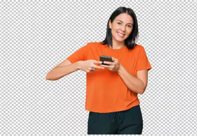 Smiling Young Woman Engaged with Smartphone in Casual Orange Top image