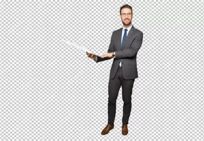 Confident Businessman in Grey Suit Holds Laptop Displaying Information for Professional Presentation image