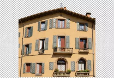Traditional Ochre Residential Building with Vintage Green Shutters and Decorative Balconies image