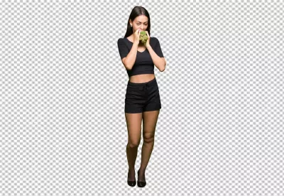 Beautiful Young Woman Appreciating the Fresh Aroma of a Green Artichoke image