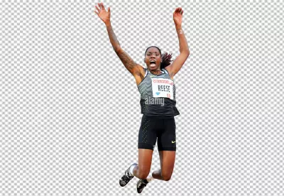 Dynamic Female Athlete in Mid-Air Long Jump Competition with Arms Raised image