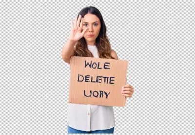 Serious Woman Displays Stop Gesture While Holding Protest Cardboard Sign image