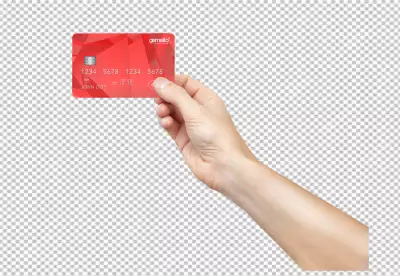 A credit cards and some coins on table surface in