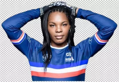 Confident Female Soccer Player in Blue Jersey and Goalie Gloves Posing image