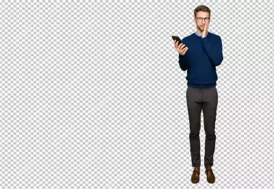 Surprised Young Man with Glasses Holding Smartphone Reacts to Unexpected News image
