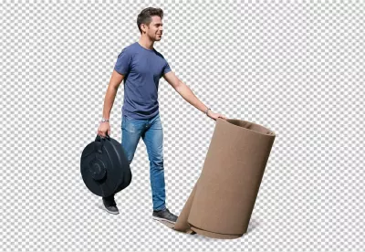Smiling Young Man Carrying Bag and Rolling Brown Carpet for Home Improvement image
