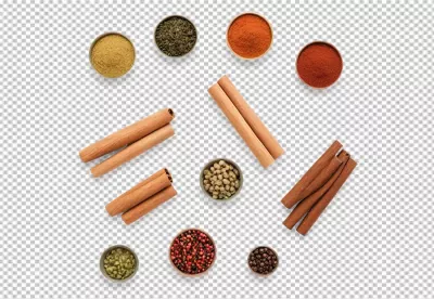 Assortment of Aromatic Spices, Herbs, and Cinnamon Sticks in Bowls on White image