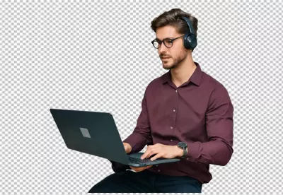 Focused Young Man with Headphones and Glasses Working on Laptop for Online Productivity image