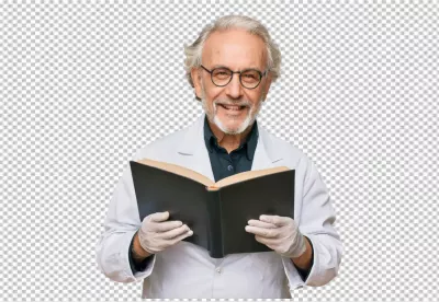 Smiling Senior Scientist in Lab Coat and Glasses Reading Research Book image
