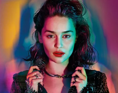 Captivating Woman with Vibrant Neon Lighting, Bold Red Lips, and Snake Jewelry image