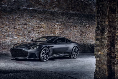 Sleek Black Luxury Sports Car in a Cinematic Dark Brick Tunnel Wallpaper image