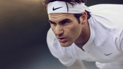 Roger Federer Intense Focus on Court Cinematic Sports Wallpaper image