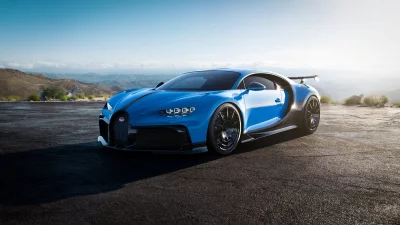Sleek Blue Bugatti Chiron Hypercar on Scenic Mountain Road at Sunset image