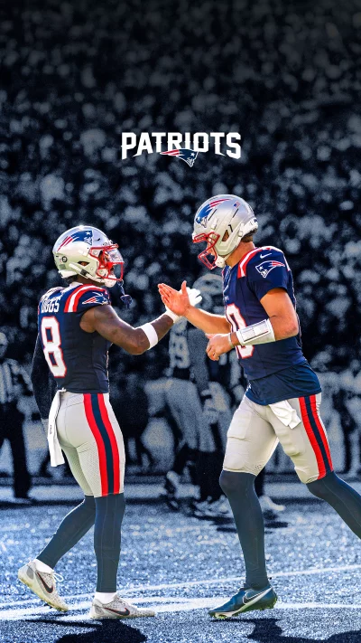 New England Patriots Football Players Celebrate Teamwork on Field image